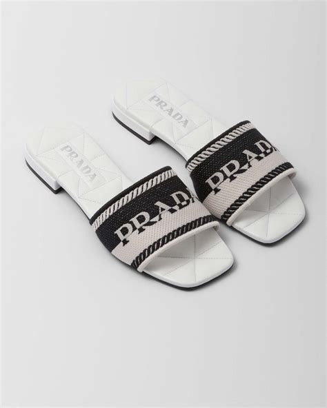 black and white prada slides.